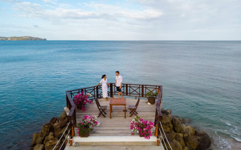A Couple on a Pier who have obtained saint lucia citizenship by investment.