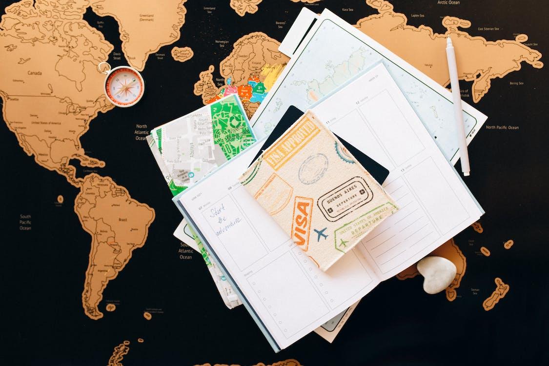 Free Passport and Visa on Top of a Planner Stock Photo