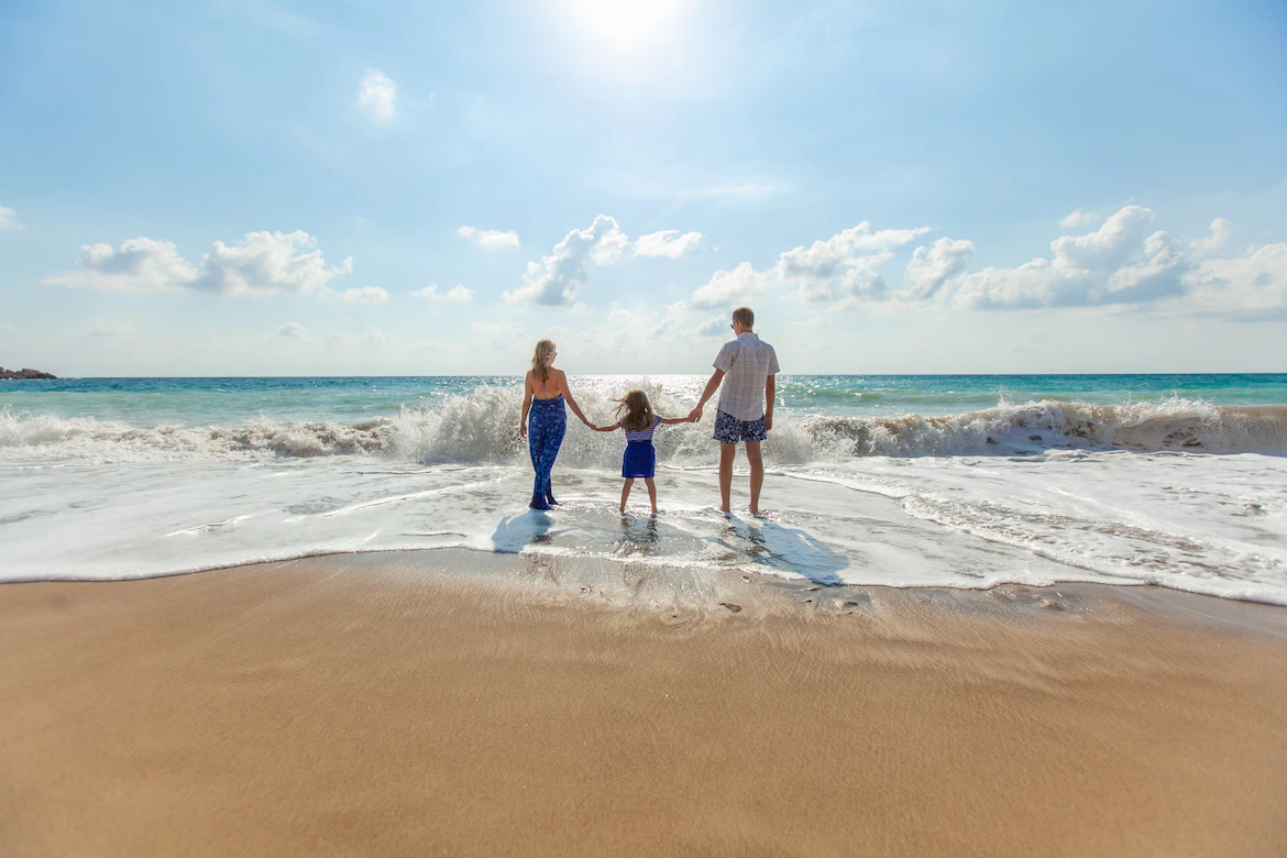 An image of a family on the beach 