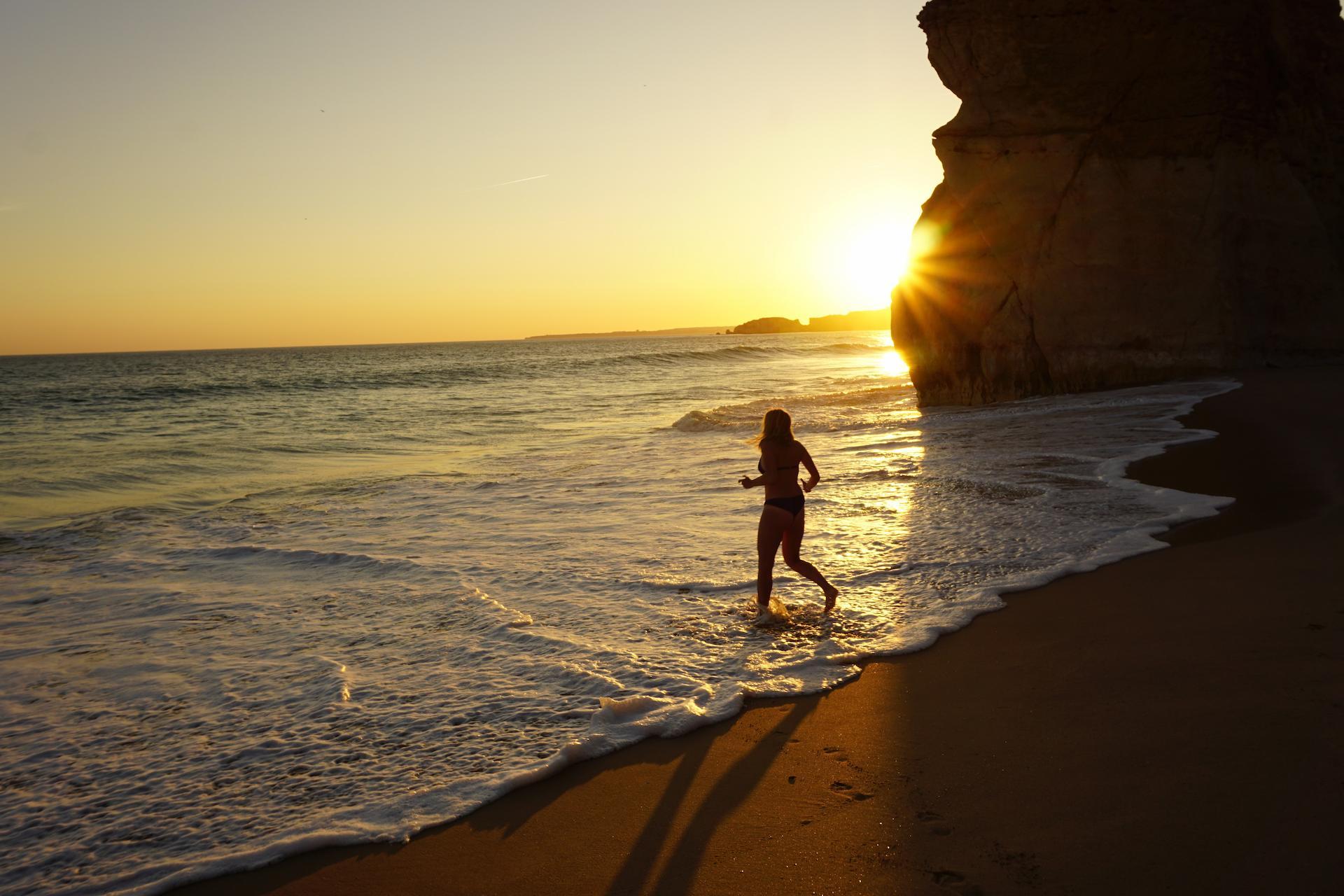 Stock Photo Woman Running On Beach In Coast Portugal