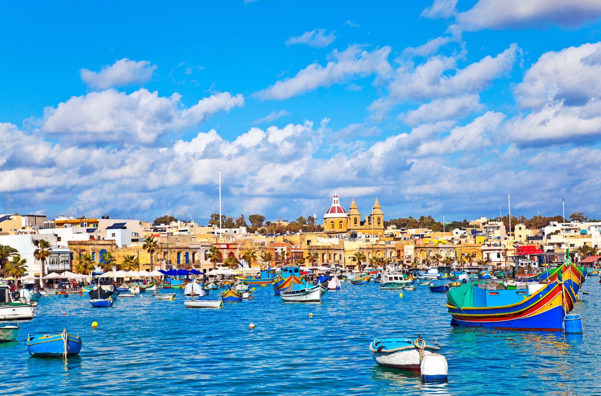 Sunny Sky With Boats On Water In Malta