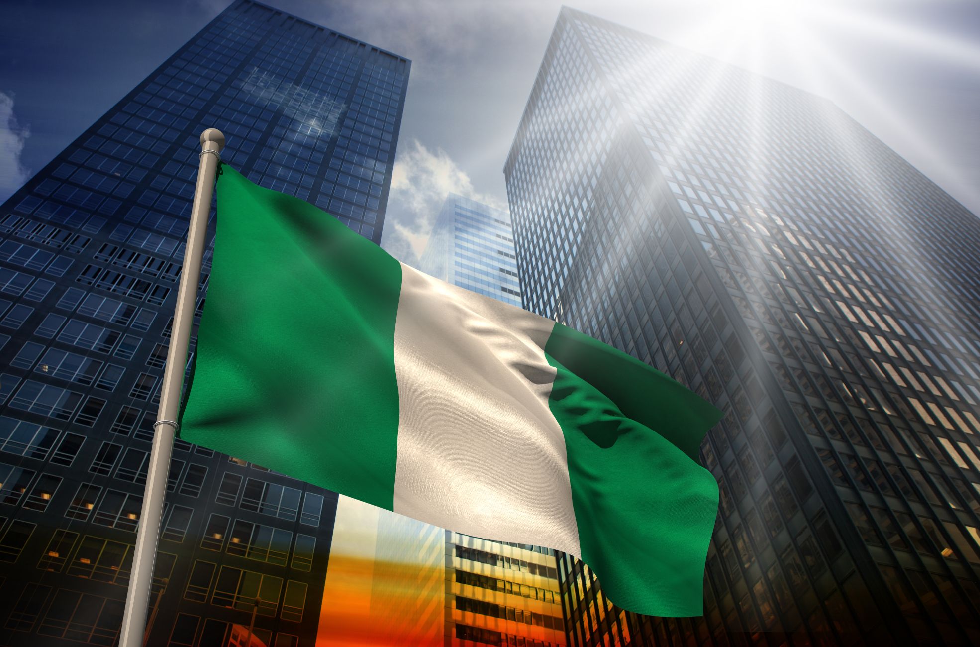 Nigerians Flag With Skyscrapers Behind