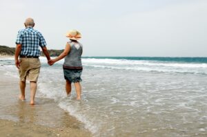 Couple On Beach Enjoying Retirement In Malta