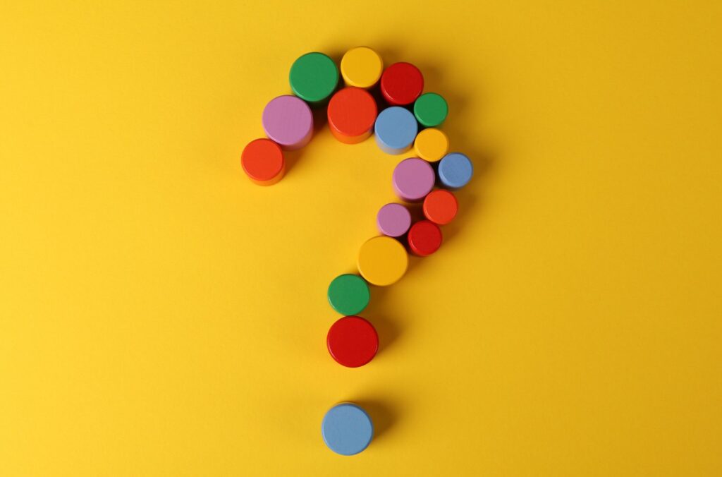 Question Mark Made Out Of Building Blocks Yellow Background