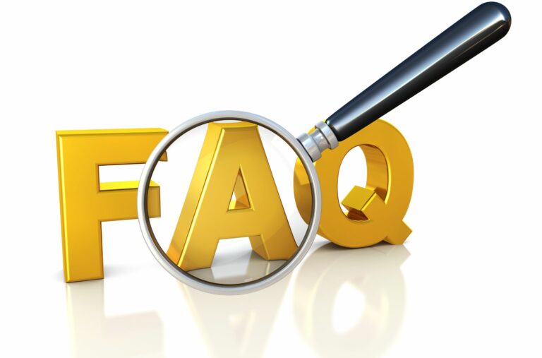 Magnifying Glass Over Word "FAQ"