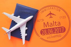 Airplane, Passport And Stamp Of Immigration To Malta