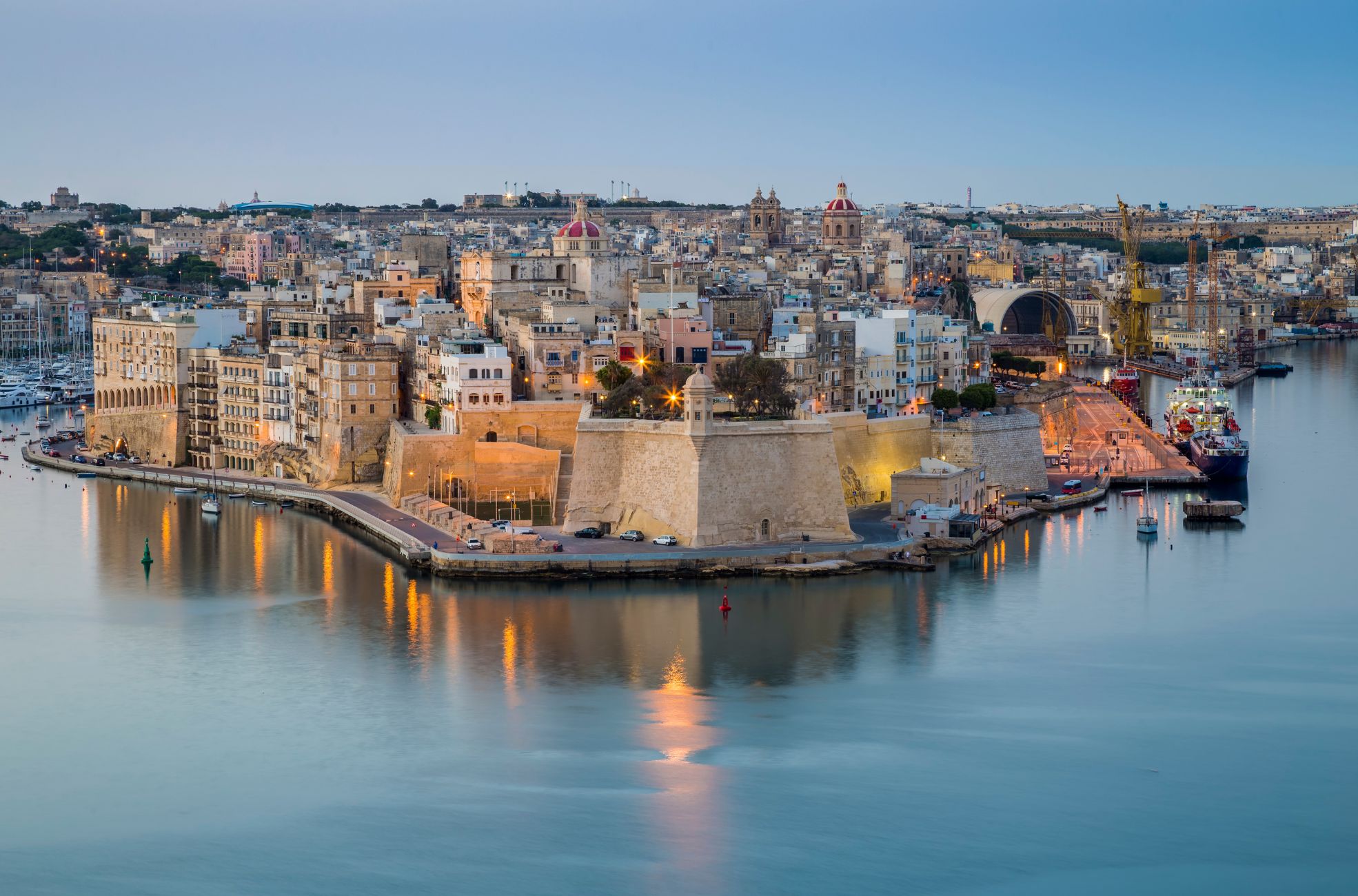 Buildings In Malta Next To Waterway